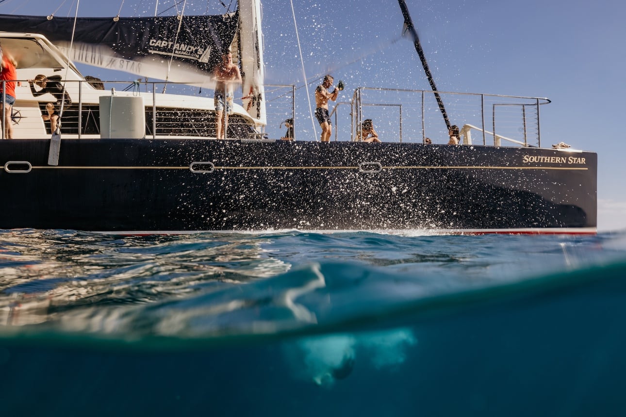 Jumping off Star Yacht on Kauai Na Pali Coast snorkeling tour.