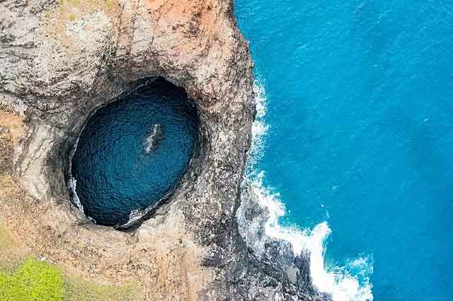 Na Pali Coast Zodiac tours Kauai boat ride from above open ceiling cave.